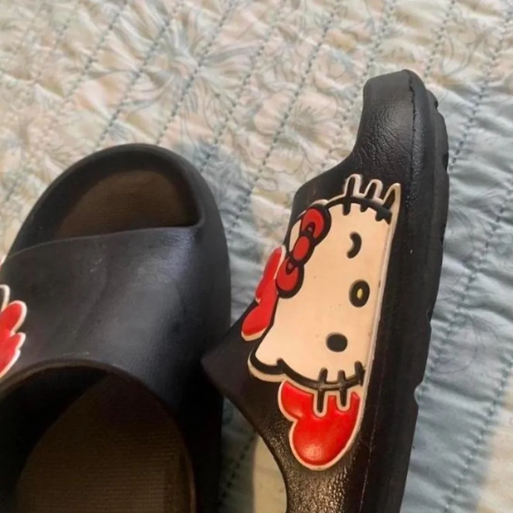 Sanrio Black Kids Hello Kitty Slide Sandals with Red and White Accents